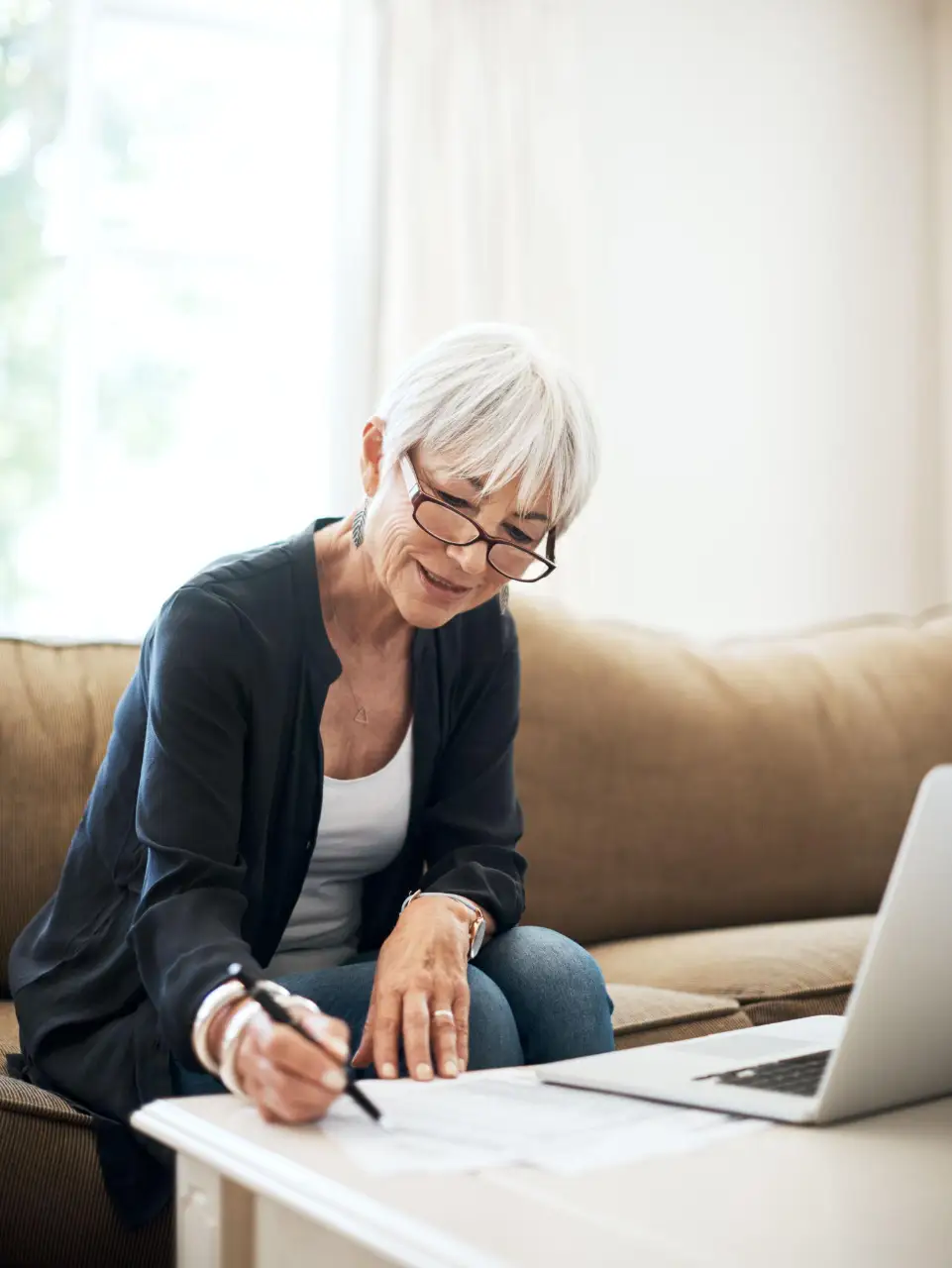 Adult female writing on paper